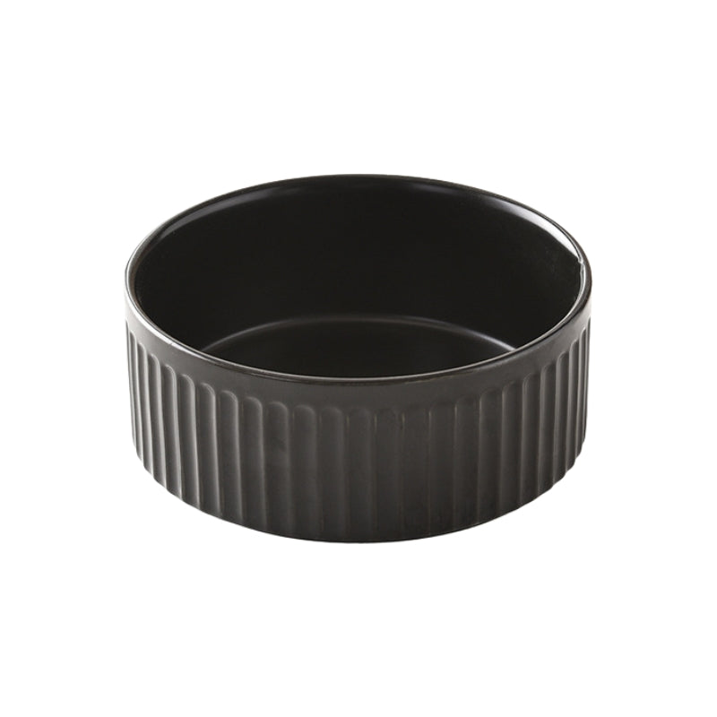 Black ceramic pet bowl with vertical ridges and a sleek, modern design.