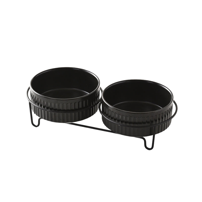 Set of two black ceramic pet bowls in a dual metal stand for food and water.