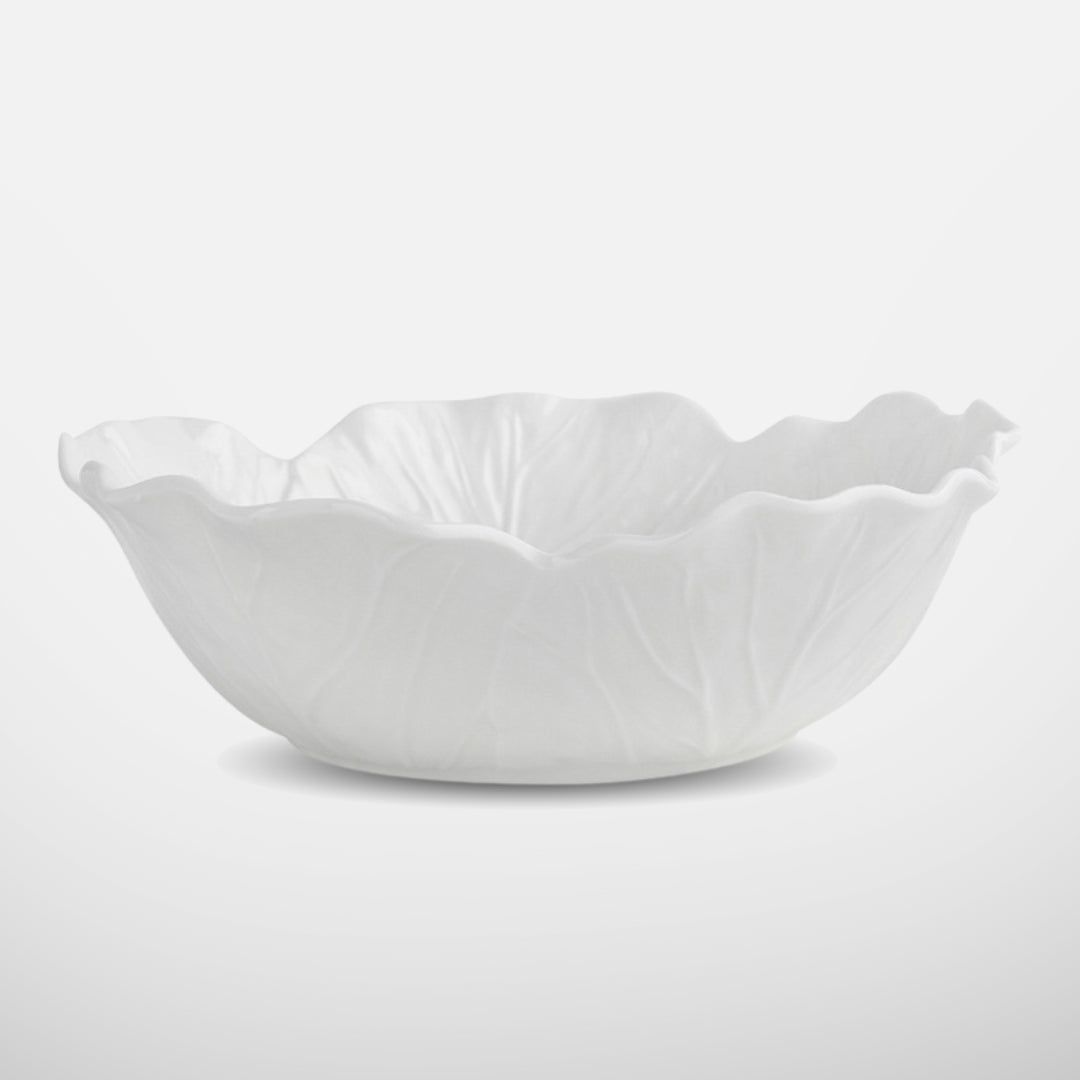 Wide and shallow white ceramic bowl with organic wavy edges