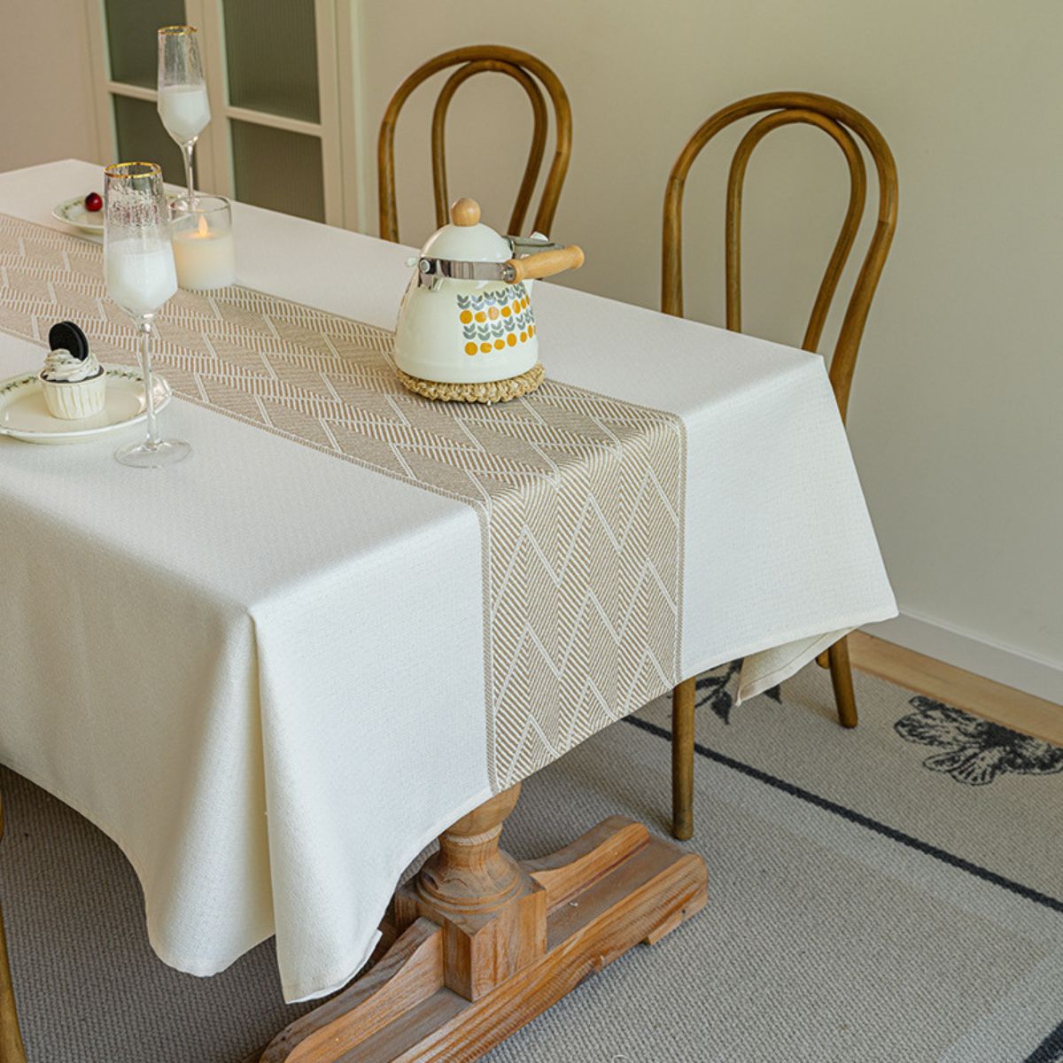 Waterproof tablecloth with beige chevron runner in cozy dining setup