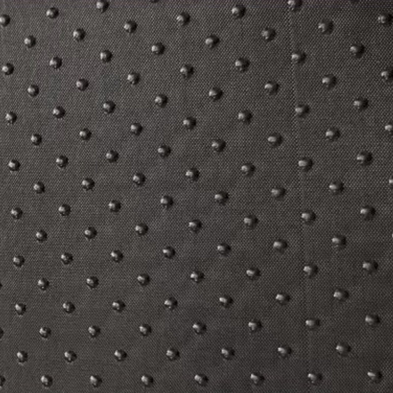  A close-up shot of the non-slip dotted texture on the bottom of a pet bed, highlighting its anti-skid safety feature.