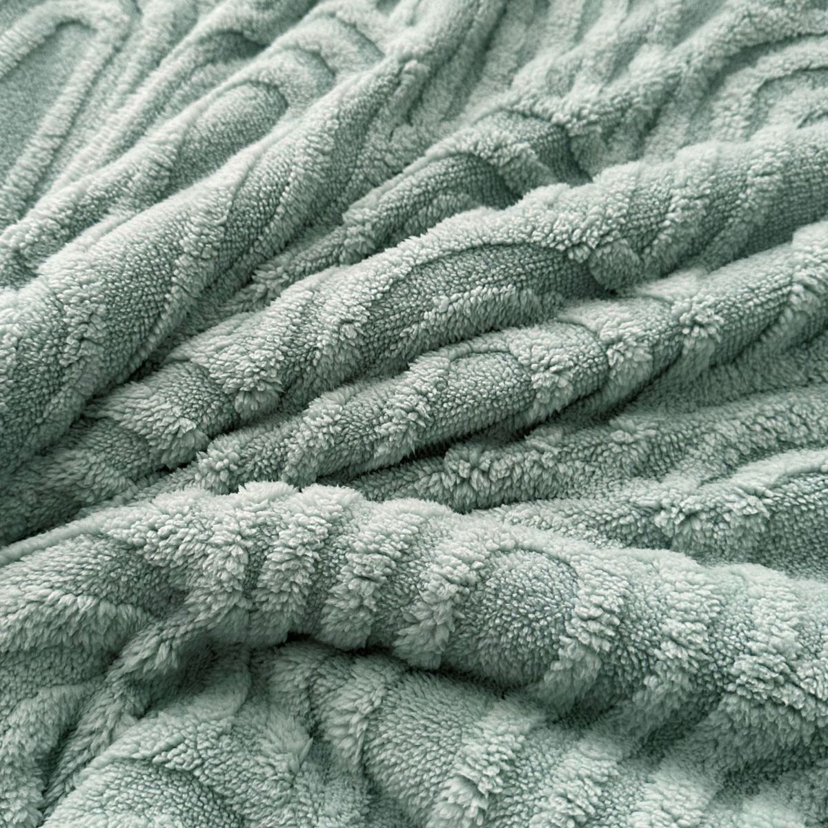 Close-up of dusty sage arch texture on soft fleece blanket