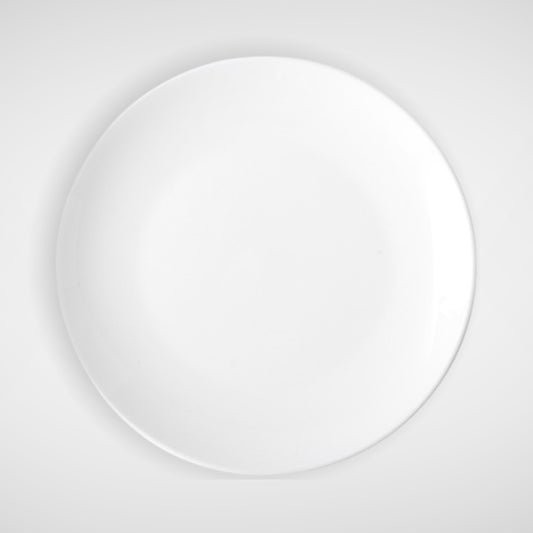 Glossy white round ceramic plate, top view on light background