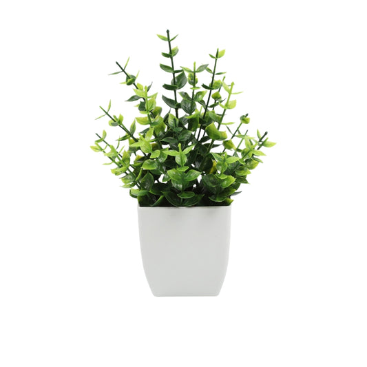 Artificial potted plant with small green leaves in white pot for home or office decor