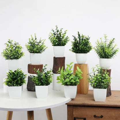 Artificial potted plants in white pots displayed on wooden shelf and stands