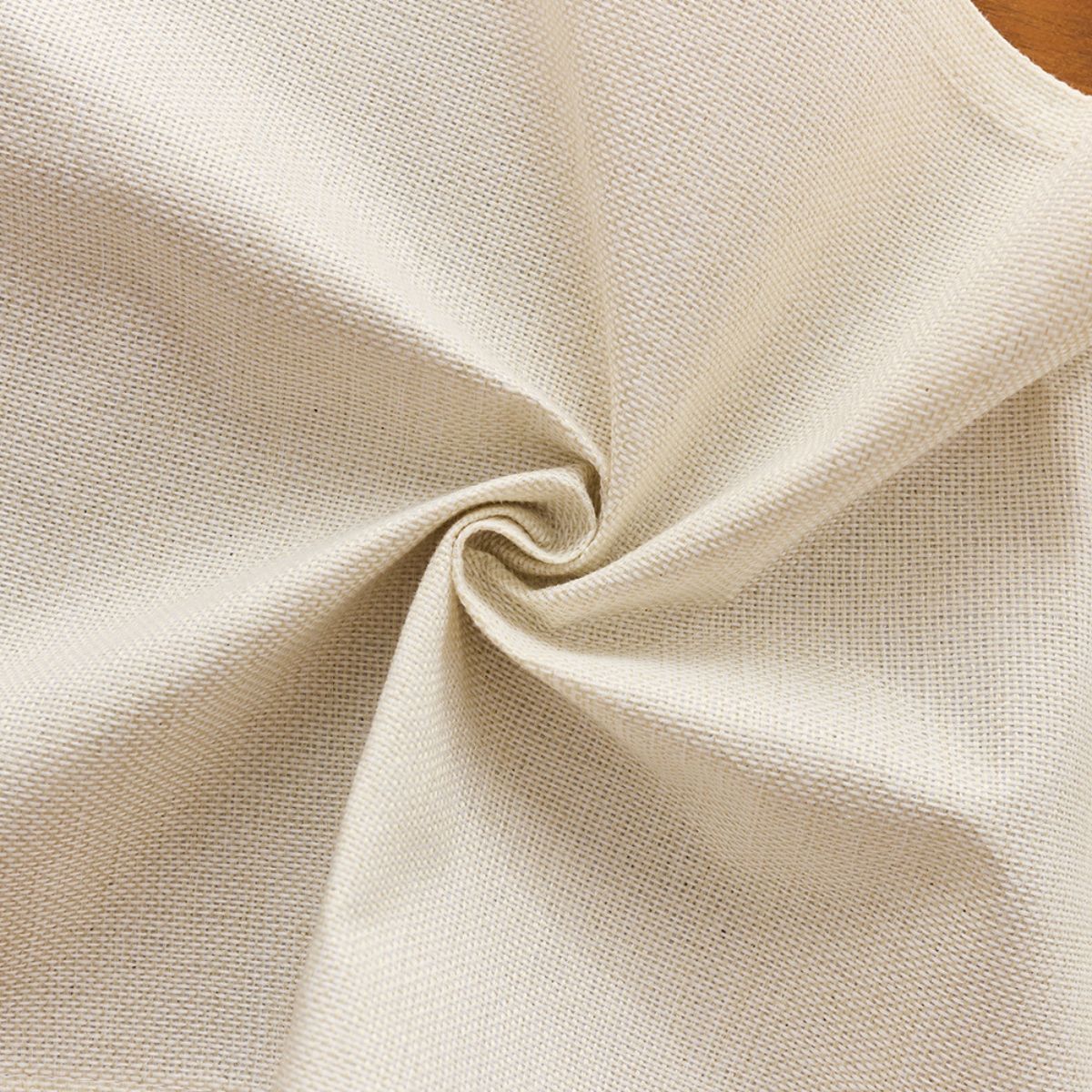 Close-up of beige cotton-linen fabric texture