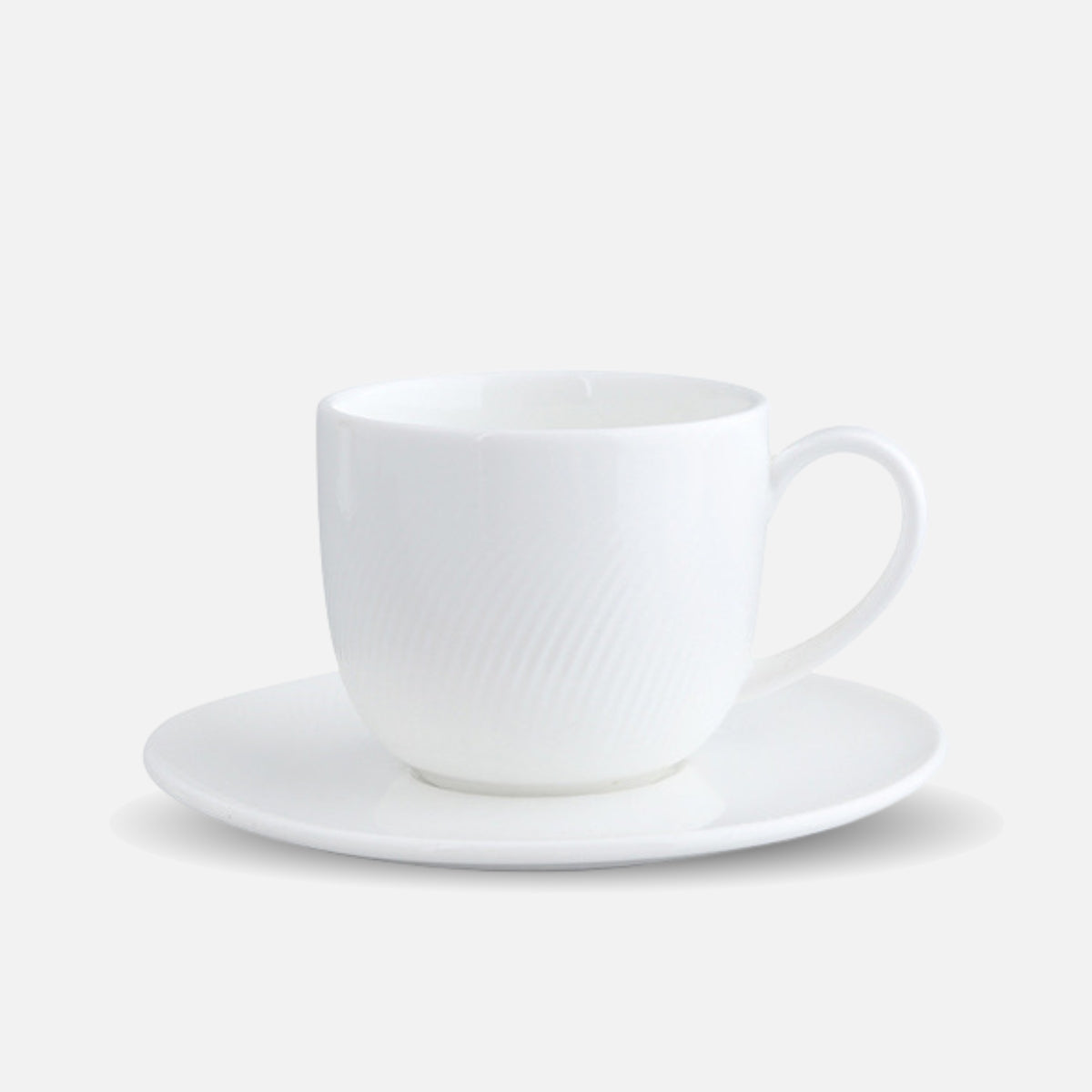 CAI porcelain coffee cup and saucer set in minimalistic design.