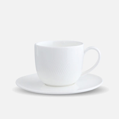 CAI porcelain coffee cup and saucer set in minimalistic design.