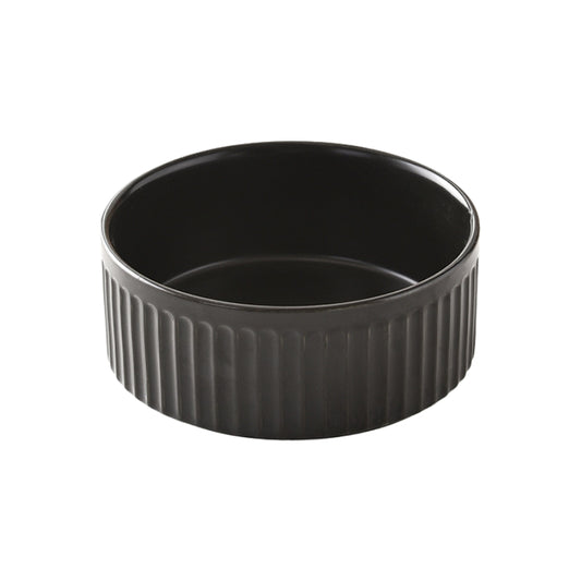 Black ceramic pet bowl with vertical ridges and a sleek, modern design.