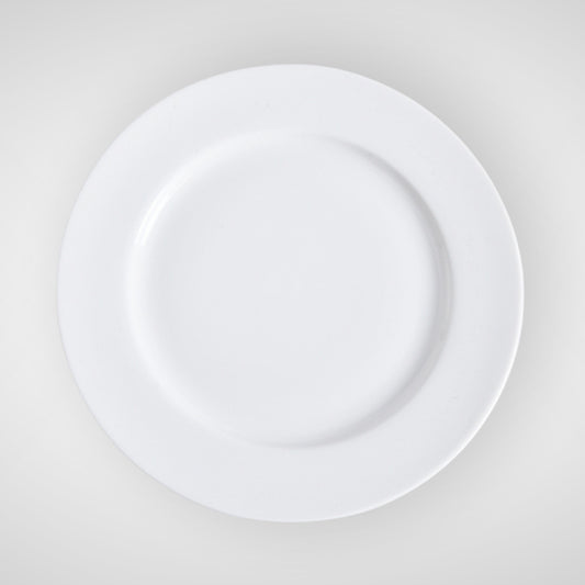 Minimalist white ceramic plate, top view on light background