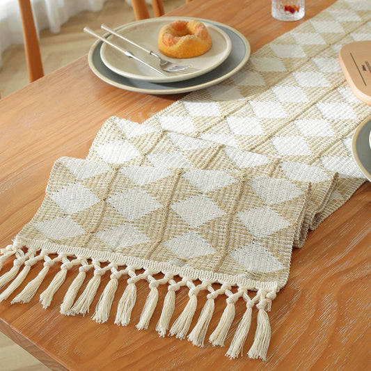 Close-up of cotton-linen diamond weave table runner with tassel edge