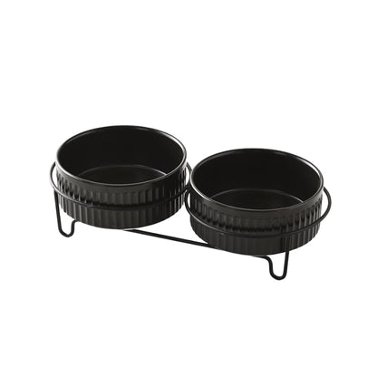 Set of two black ceramic pet bowls in a dual metal stand for food and water.
