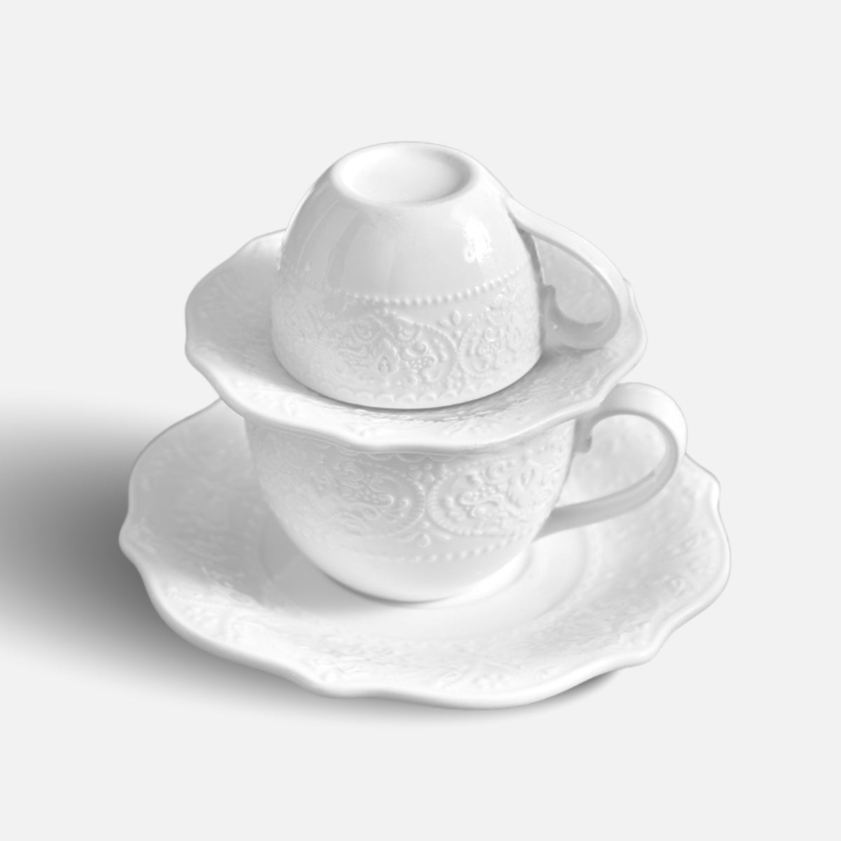 JUN HUA stacked ceramic cup, saucer and sugar bowl set with embossed detailing.