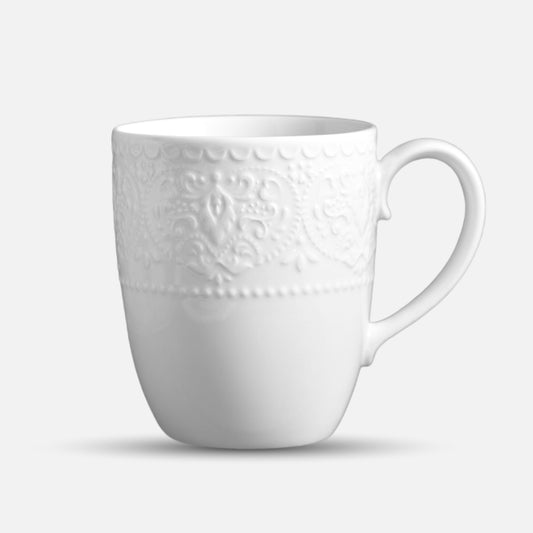 JUN HUA white ceramic mug with embossed floral pattern and curved handle.