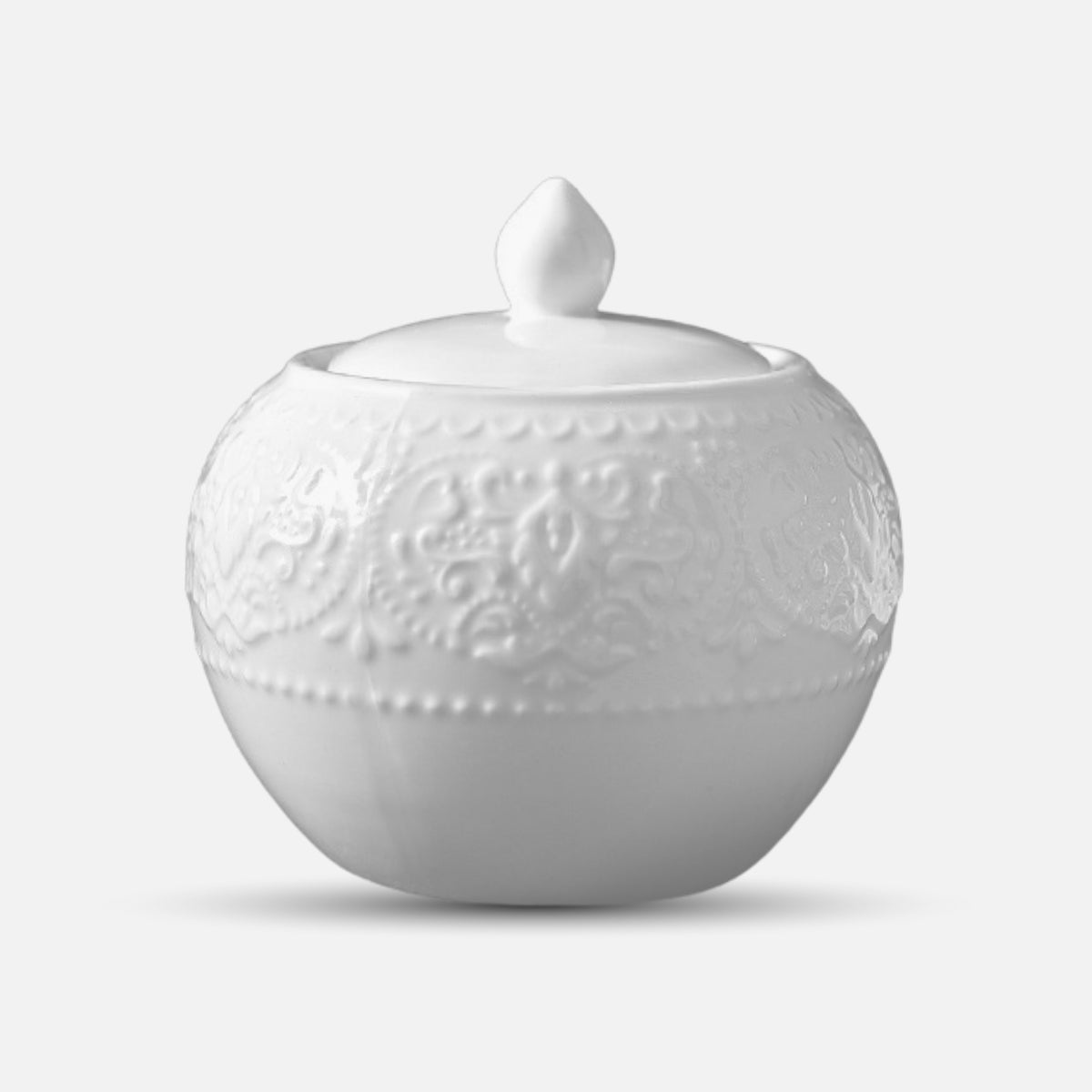 JUN HUA ceramic sugar jar with lid and ornamental surface texture.
