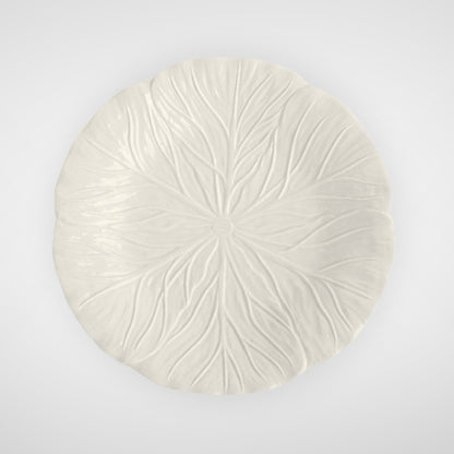 White ceramic plate with leaf texture, top view on plain background