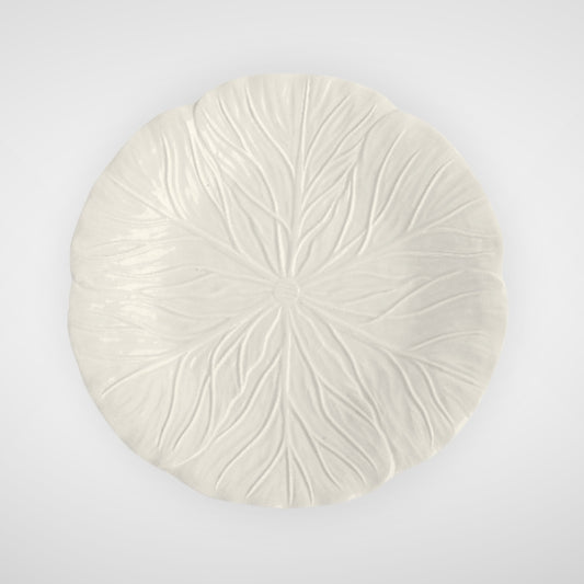 White ceramic plate with leaf texture, top view on plain background