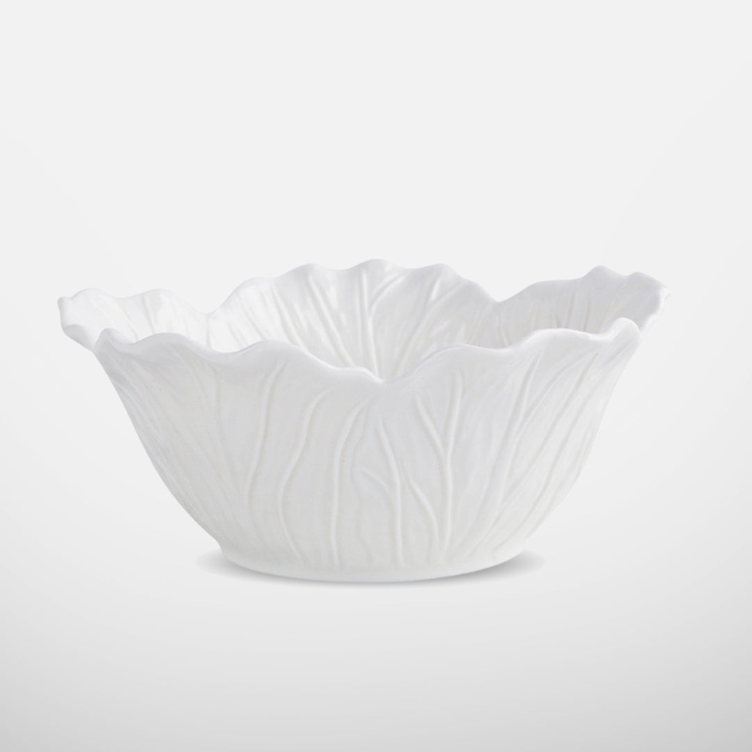 White ceramic bowl with lettuce-leaf texture and flared rim, side view