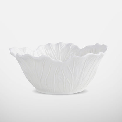 White ceramic bowl with lettuce-leaf texture and flared rim, side view
