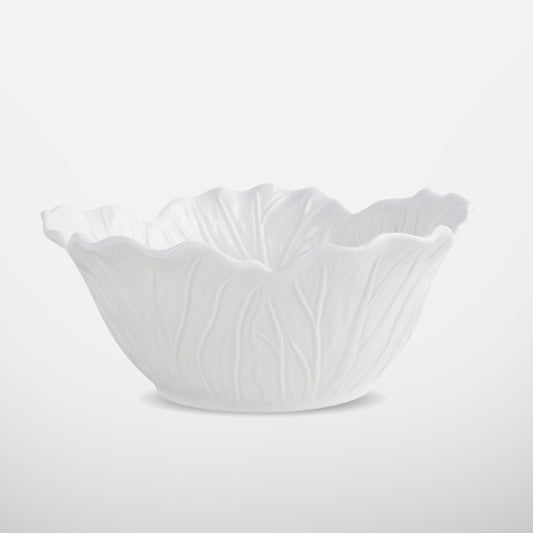 White ceramic bowl with lettuce-leaf texture and flared rim, side view