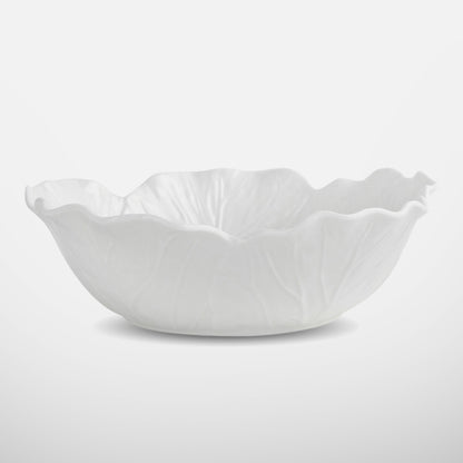 Wide and shallow white ceramic bowl with organic wavy edges