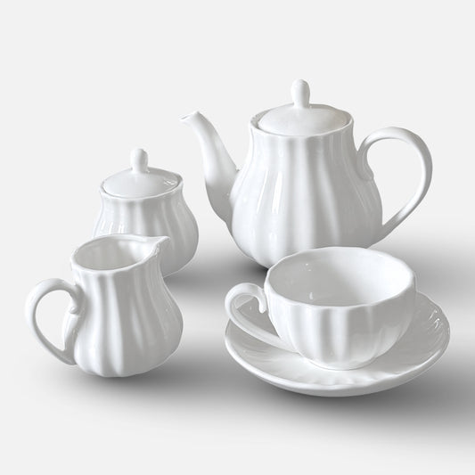 NAN GUA ceramic tea and coffee set including teapot, milk jug, sugar jar, and cup with saucer.