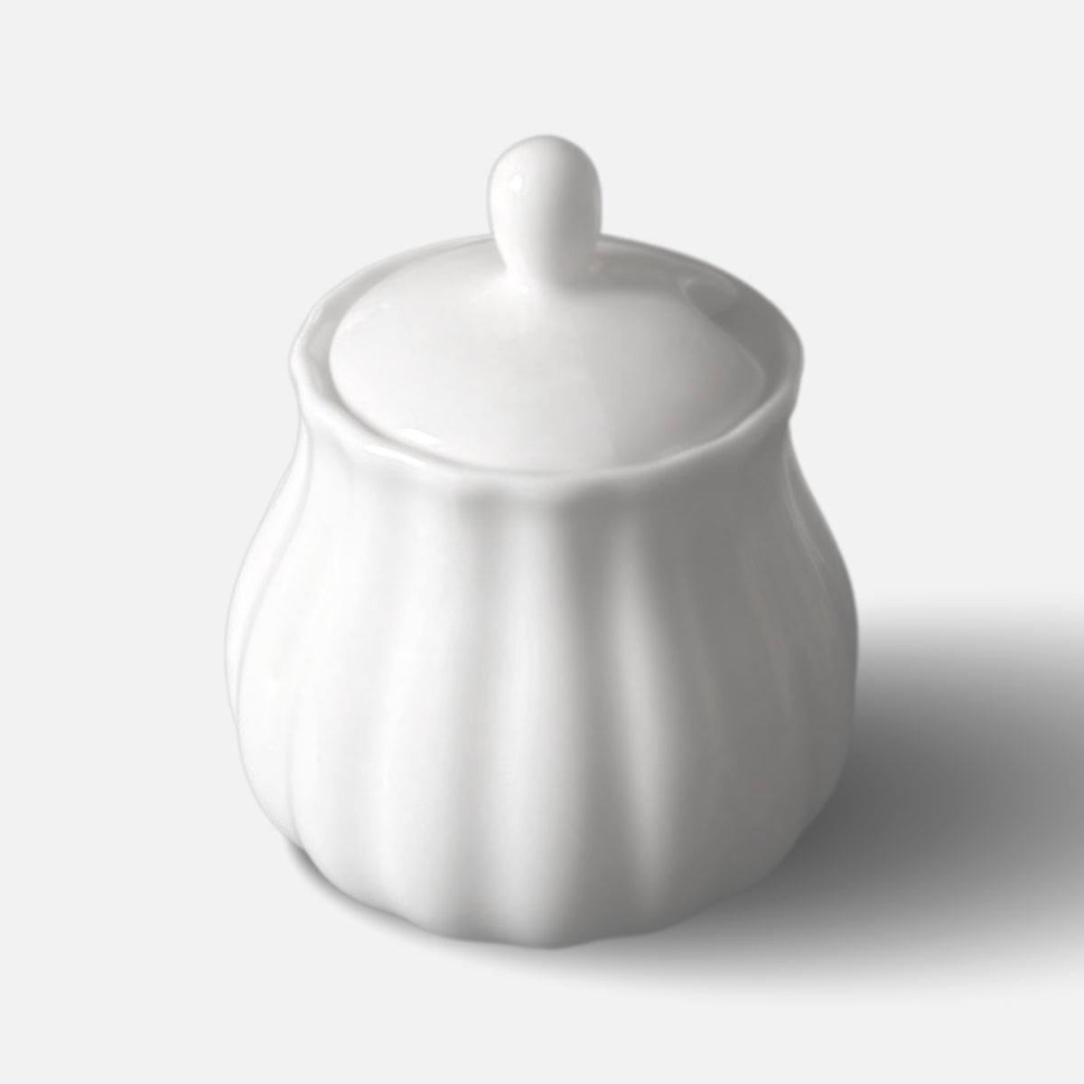 NAN GUA ceramic sugar jar with lid, featuring rounded fluted silhouette.