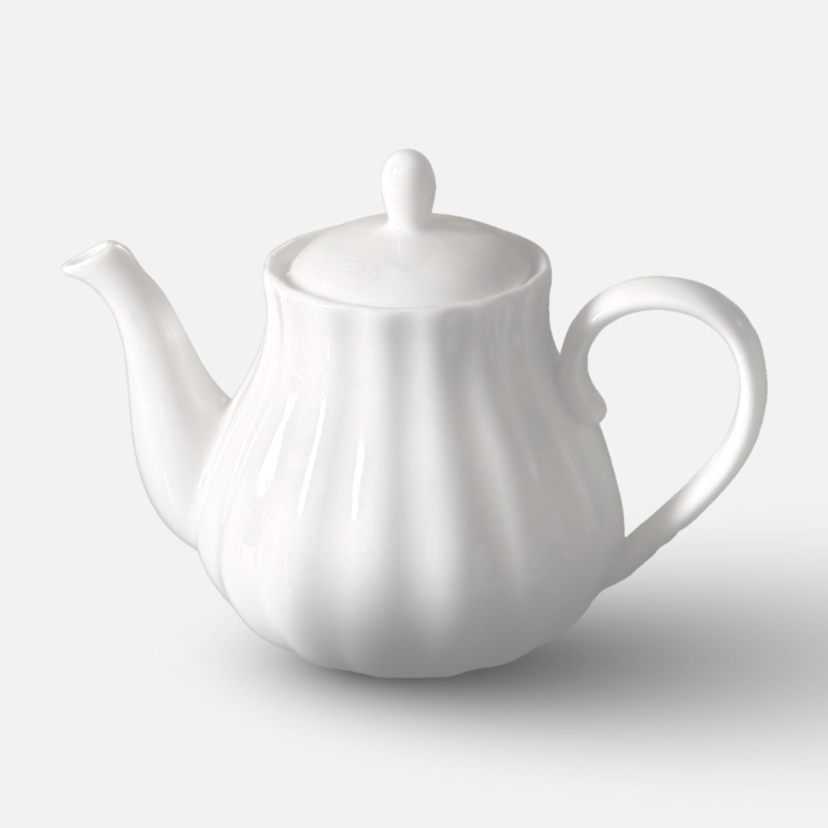 NAN GUA white ceramic teapot with pumpkin-inspired fluted shape and curved handle.