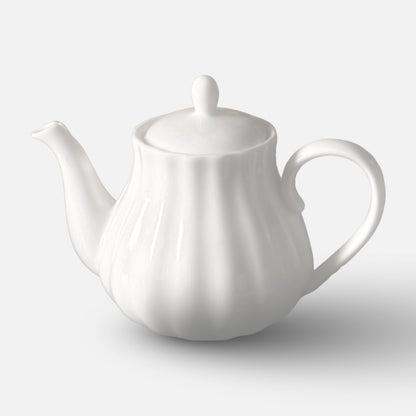 NAN GUA white ceramic teapot with pumpkin-inspired fluted shape and curved handle.