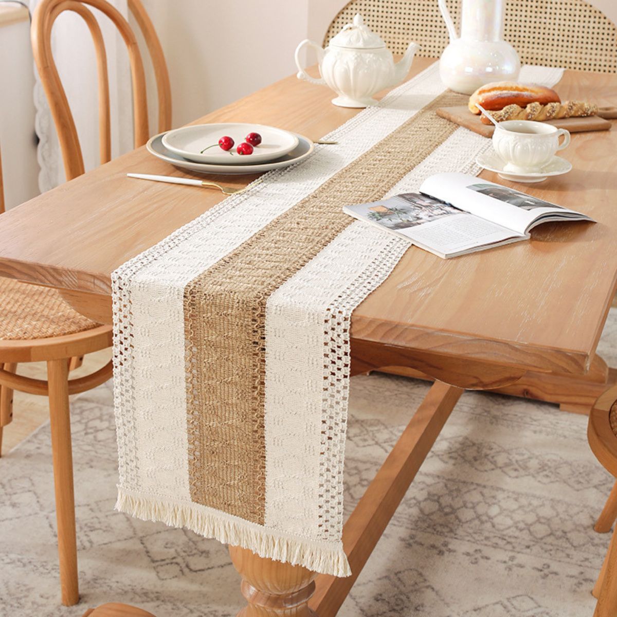 Rustic linen table runner styled on wooden table with tea set