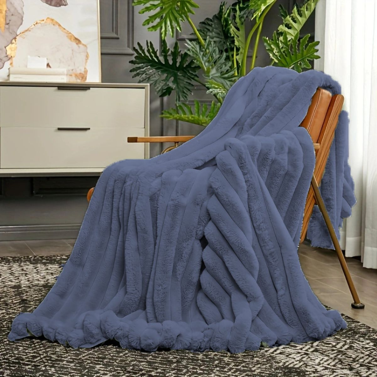 Navy blue variant of plush throw blanket on chair