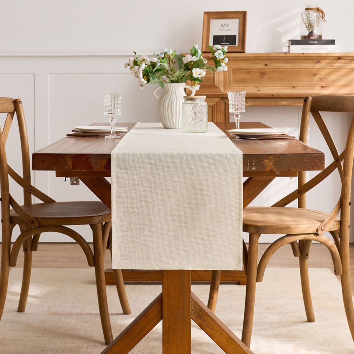 Full dining setup with minimalist beige table runner