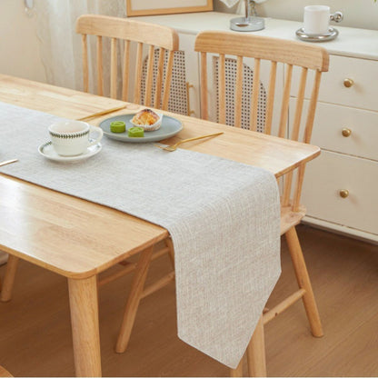 Earth tone table runners displayed on wooden table
