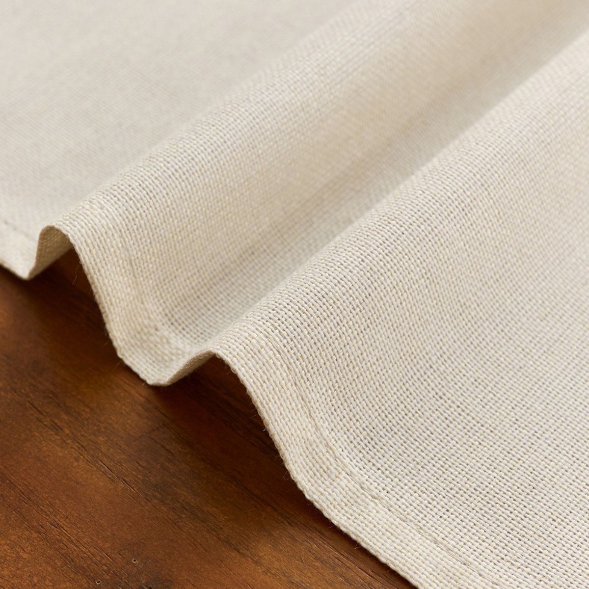 Folded hem detail of natural table runner