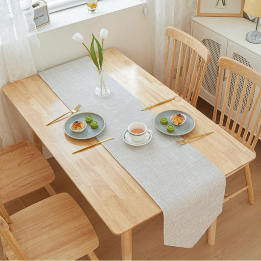 Multi-color table runners layered on dining table