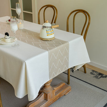 Waterproof tablecloth with beige chevron runner in cozy dining setup