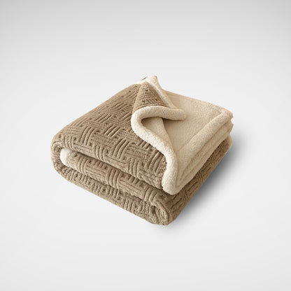 Folded beige throw blanket with sherpa fleece lining and basketweave texture