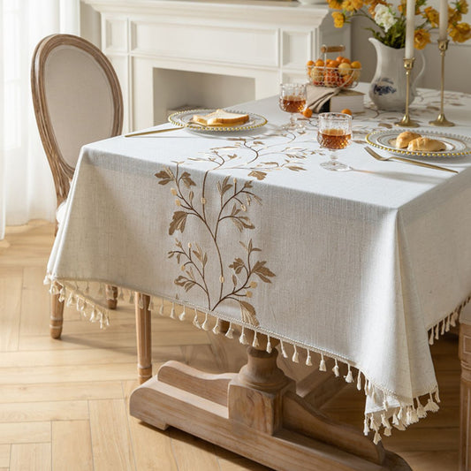 Beige waterproof tablecloth with floral embroidery and tassels